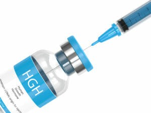 human growth hormone vial and needle