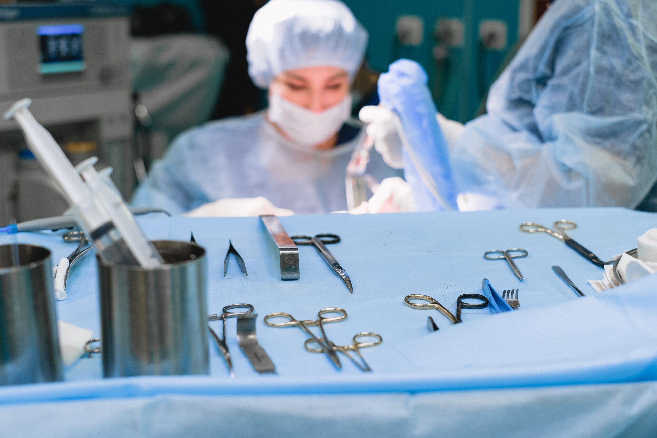 Surgeons operating inside an operating room