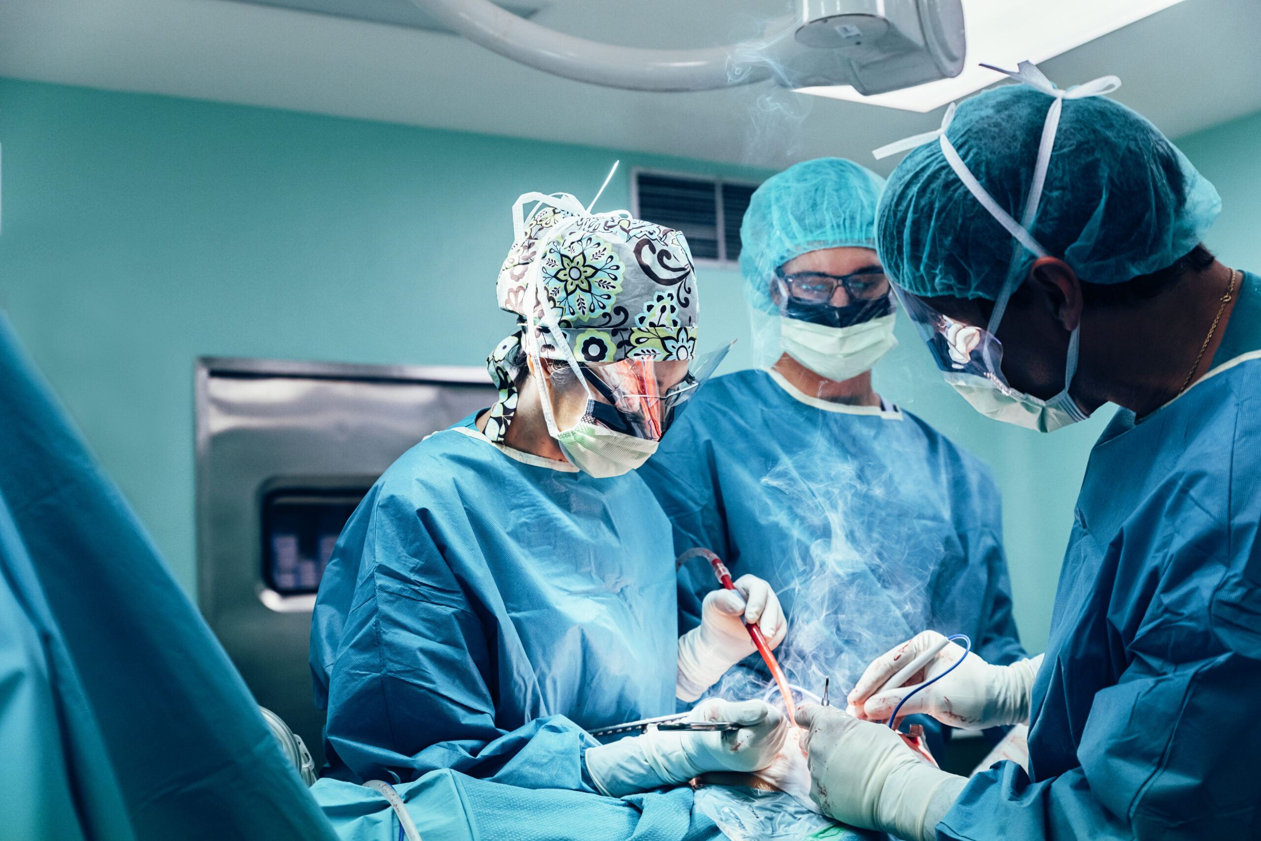 A group of dedicated surgeons in an operating room.
