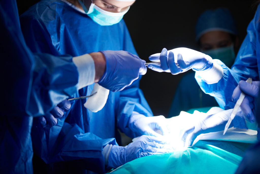 Group of surgeons passing the scalpel during surgery