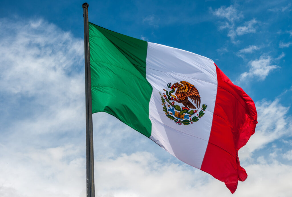 Flag of Mexico with a sky background