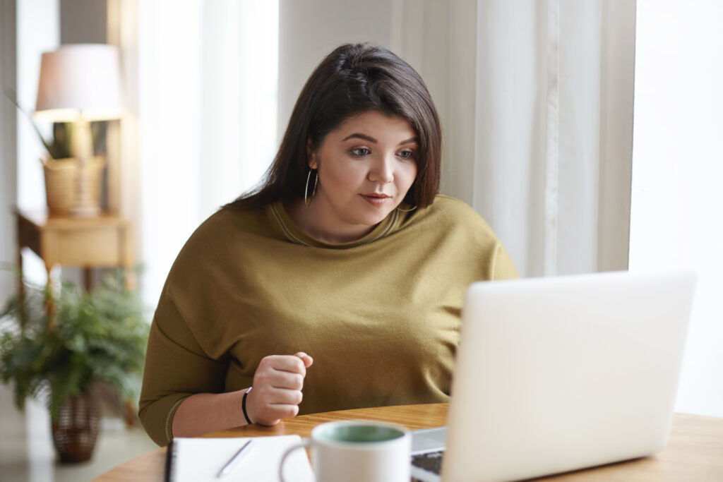 Overweight woman on a video call.