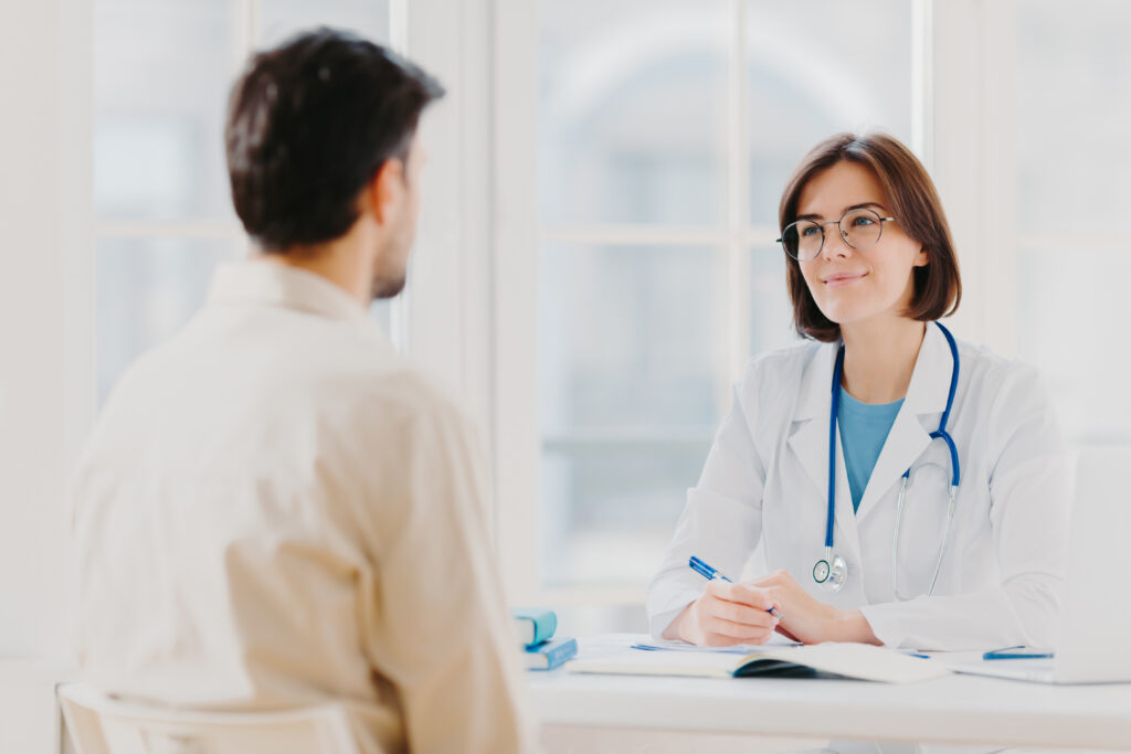 Doctor talking to her patient in a doctor's office